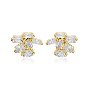 Detailed macro view of gold-plated geometric stud earrings with clear rectangular crystals