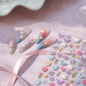 3D embroidery garden nail stickers featuring butterfly and daisy patterns on pastel nails