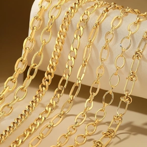 Various styles of golden stainless steel chains including Cuban and paperclip links