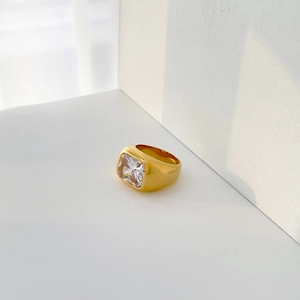 Detailed view of wide 18K gold plated ring featuring a large square-cut zircon stone