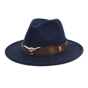 Close-up of longhorn bull metal buckle on a navy blue wool felt fedora hat strap