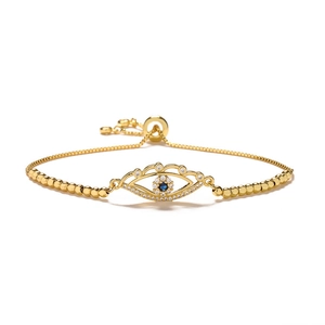 Adjustable gold evil eye bracelet with blue zircon accents and a sliding bead clasp