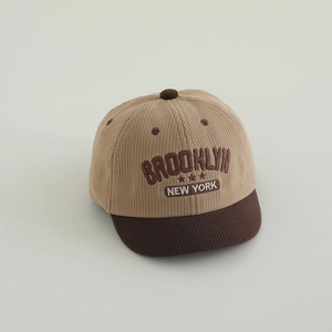 Detail of Brooklyn embroidery on a khaki and brown corduroy baby baseball hat