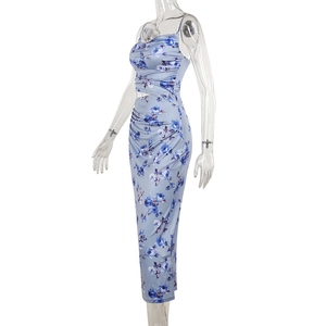 Detail view of the floral print pattern and slim fit waist of the blue beach maxi dress