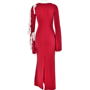 Detail view of red long dress showing back slit and white lace-up sleeve decoration