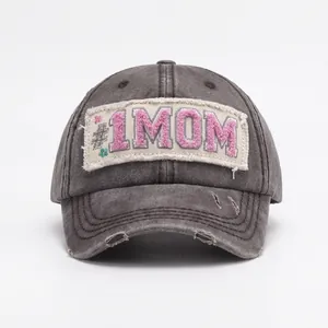 Vintage dark grey washed baseball cap with pink #1 MOM embroidery and distressed details