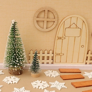 Miniature Christmas set with snowy trees, wooden elf door, and fence for DIY holiday decor