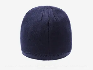 Detailed back view of a dark blue knitted beanie showing high-quality stitch texture