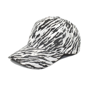 Detailed close-up of a six-panel leopard baseball cap with black and white zebra pattern