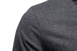 Detailed view of the shoulder seam on a dark grey long-sleeve v-neck cotton t-shirt
