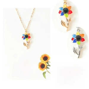 Detail of colorful sunflower necklace in gold and silver finish with rainbow petals