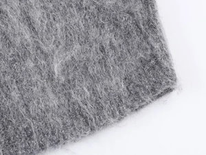 Close-up of grey double-sided knit fabric with soft mohair texture and plush fibers