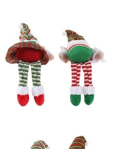 Detailed view of Christmas elf dolls featuring red and green striped stockings and shoes