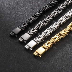 Byzantine king chain bracelets in black, silver, and gold finishes with folding clasps