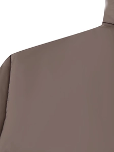 Detail view showing the shoulder seam and coffee brown fabric texture of a puffer jacket