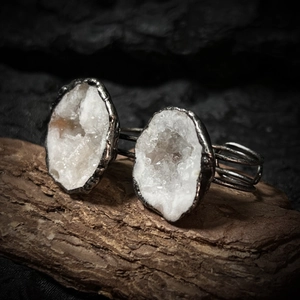 Macro detail of natural geode crystal druzy set in handmade silver plated ring band