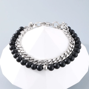 Detail of double-layer men's bracelet with silver Cuban chain and matte black onyx beads