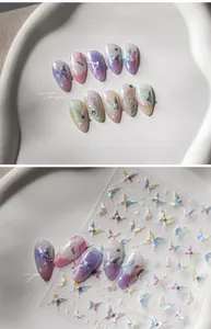 Macro detail of gradient butterfly nail stickers with pearlescent finish and rhinestones