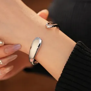 Minimalist silver waterdrop open cuff bracelet with a polished mirror finish for women