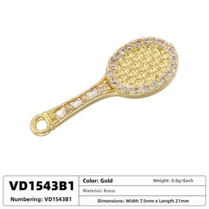 Macro detail of gold-plated brass tennis racket pendant with sparkling zircon stones