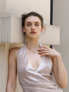 Close-up of 18K gold-plated multilayer necklace with heart and zircon drop charms