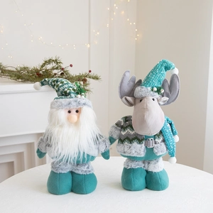 Detailed view of teal and grey plush Christmas gnome and reindeer dolls with knit fabric