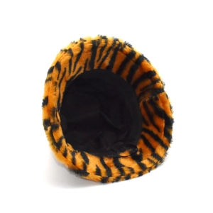 Close-up of fluffy tiger print faux rabbit fur bucket hat with warm plush texture