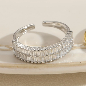 Macro shot of silver open ring with double-row sparkling cubic zirconia stones