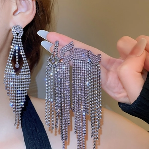 Sparkling long tassel heart earrings with silver finish and shimmering crystal rhinestones