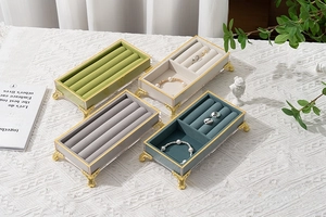 European vintage jewelry display trays with velvet lining and gold embossed stands