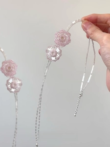Close-up of pink and clear beaded flower necklace with silver lobster clasp and extension chain