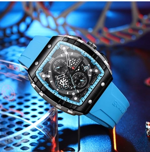 Macro side view of black tonneau case and blue silicone strap of quartz chronograph watch