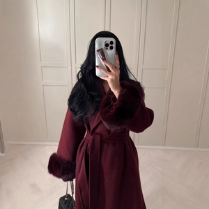 Women's long burgundy wool coat with faux fur trim and matching waist belt