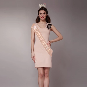 Detail of pink glitter sash and metallic crown featuring Birthday Queen text for women