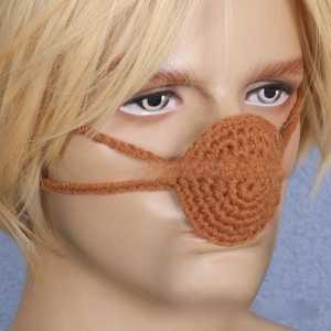 Close-up of brown crochet nose warmer with ear loops on mannequin for party costume