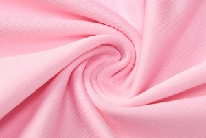 Macro shot of soft pink high-elasticity knitted fabric with breathable mesh texture
