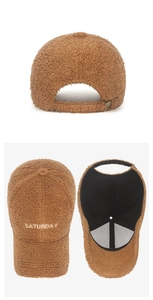 Detail of brown faux shearling baseball cap with white Saturday embroidery and adjustable strap
