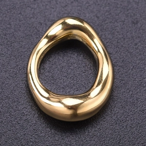 Macro shot of the irregular golden streamlined pendant showing polished finish and texture