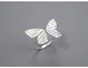 Macro detail of polished S925 silver butterfly ring with adjustable open band