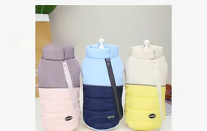 Close-up of waterproof color-block pet vests with high collars and diagonal side zippers