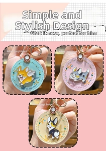 Detail of Corgi charms in mint green, pink, and beige faux leather on alloy keychains