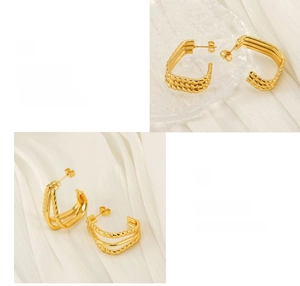 Macro detail of triple-layer gold titanium steel earrings with high-polish texture