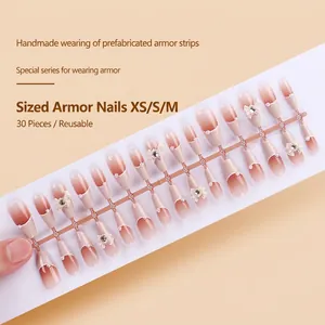 Detailed set of 30 pink gradient press-on nails with bow knots and pearl accents