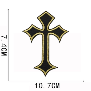 Detailed view of gold and black cross embroidered patch measuring 10.7cm by 7.4cm