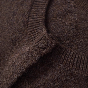 Deep brown knitted cardigan for women featuring soft wool texture and buttoned round neck