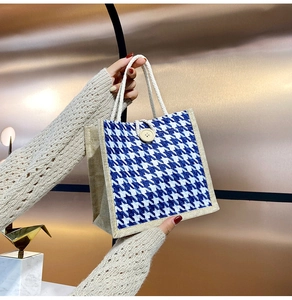 Blue and white houndstooth canvas tote bag with cotton rope handles and wood button