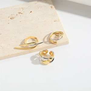 Set of three minimalist irregular open rings in gold and silver polished metal finishes