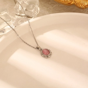 Elegant silver titanium necklace with pink cat eye stone pendant and crystal halo detail