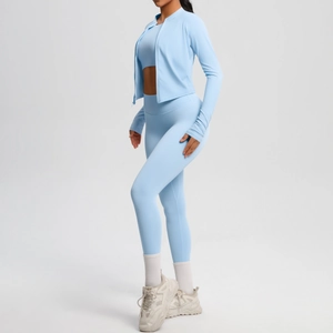 Three-piece light blue yoga set with zipper jacket, sports bra and high-waisted leggings