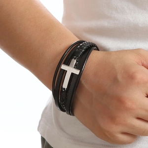 Men's multilayer black braided leather bracelet with silver cross pendant on wrist